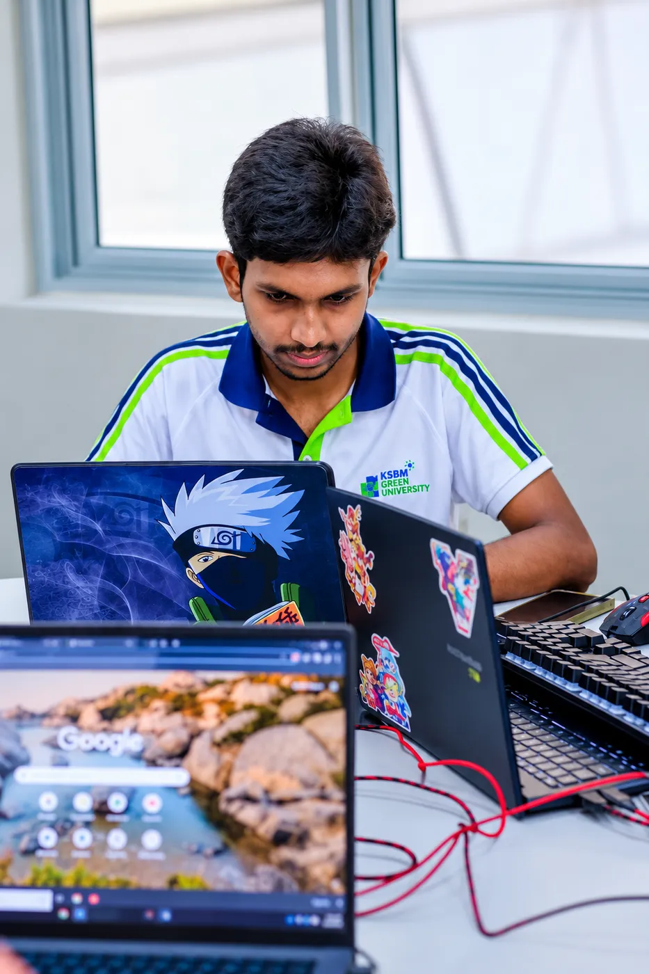 Coding at a laptop during the Duothen 3.0 hackathon.